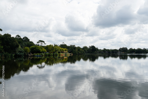Wallpaper Mural Soustons lake in Azur France showing tranquil water and moored boats Torontodigital.ca
