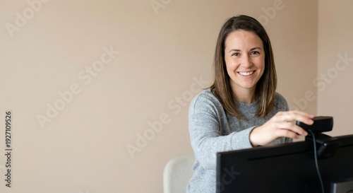 Happy Woman Setting Up Webcam for Video Conference Call in Modern Home Office, Smiling Remote Worker Preparing Hybrid Meeting