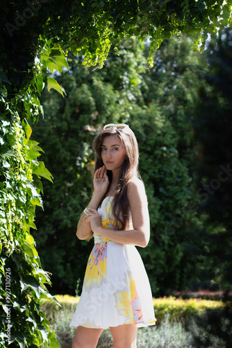 a young girl in a beautiful garden in spring