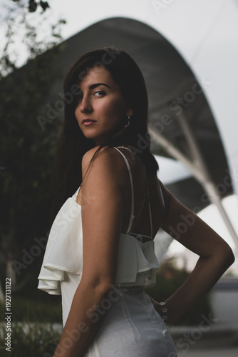 young girl against the backdrop of a beautiful ceiling in a shopping centre