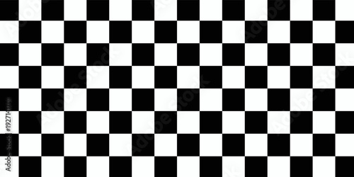 A classic black and white checkerboard pattern with alternating squares creating a simple, repeating geometric grid.