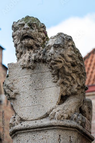 Historic Heraldic Column Sculpture in Bruges
