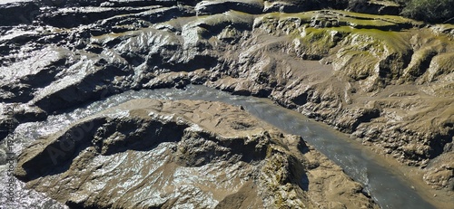 Foto Water channels carved through mudflats at low tide in Tagus River estuary, Portugal