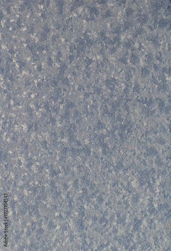 The snow on the window. abstract gray background