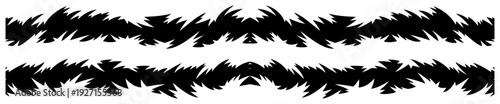 Sharp jagged border patterns in black and white resembling stylized grass or fire