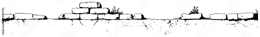 Obraz premium Old ruined stone wall with grass growing on top