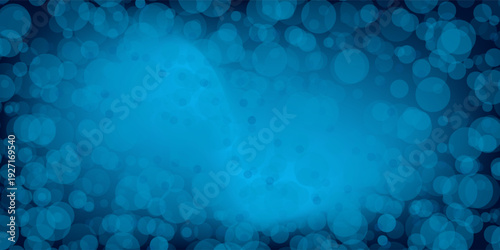 Shiny blue bokeh background with circles and flashes