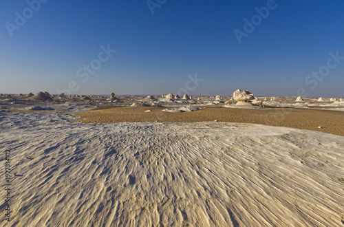Beautiful landscape with white mineral rocks and sand in the White Desert near Farafra oasis in Egypt