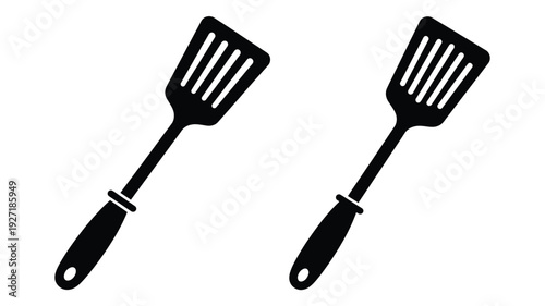 Two black spatulas displayed diagonally a minimalist silhouette