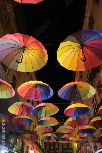 colorful umbrellas decorations in Pink Street (Rua Nova do Carvalho) in Lisbon's Cais do Sodré neighborhood