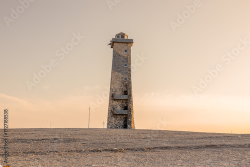 Modern Navigation Tower and Historic Stone Lighthouse at Cabo San Román