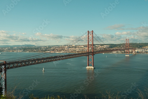 фотографія 25 de Abril Bridge in Lisbon, Portugal - a stunning, 2,277-meter-long suspension