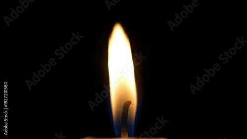 Orange candle flame on wick with dark background mood light animation