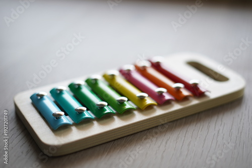 Children's colorful xylophone. It is made of wood and metal.
