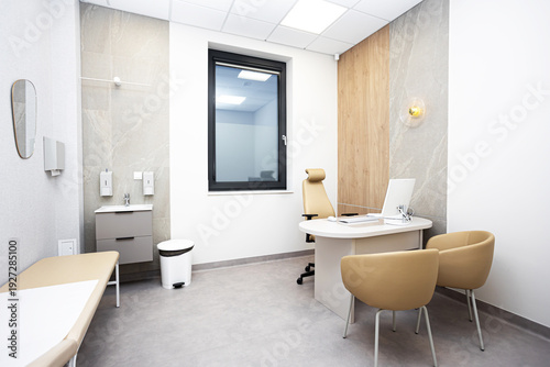 Billede på lærred Modern medical consultation room interior with desk, chairs and examination bed