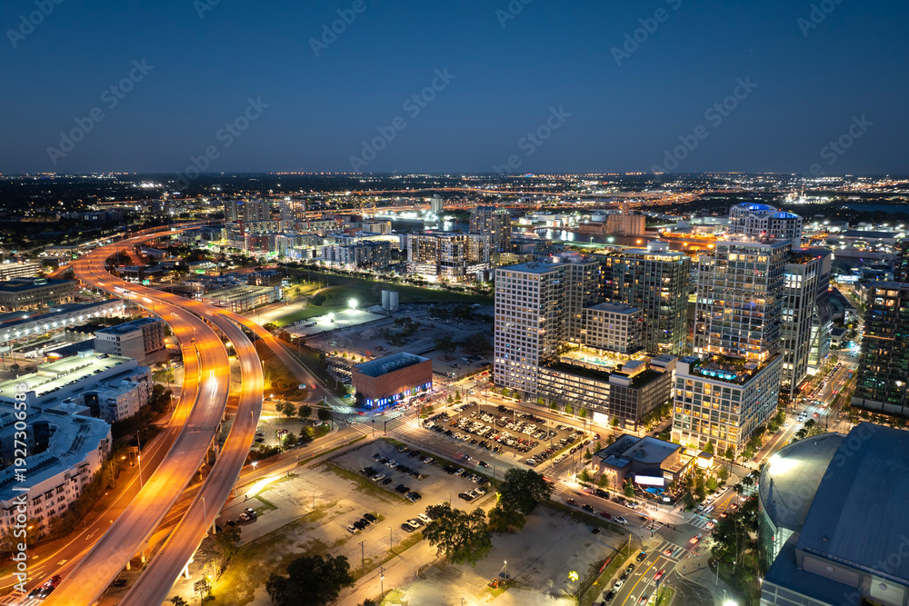 Fototapeta premium Rush hour traffic on multi-lane highway in Tampa, Florida. Rhythm of city life at night.