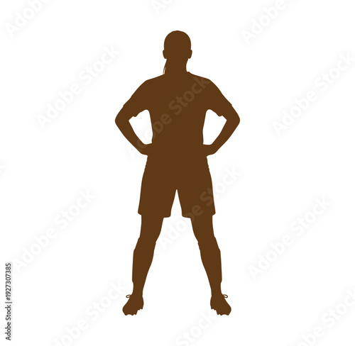 Brown silhouette of a man standing with hands on hips in casual athletic wear
