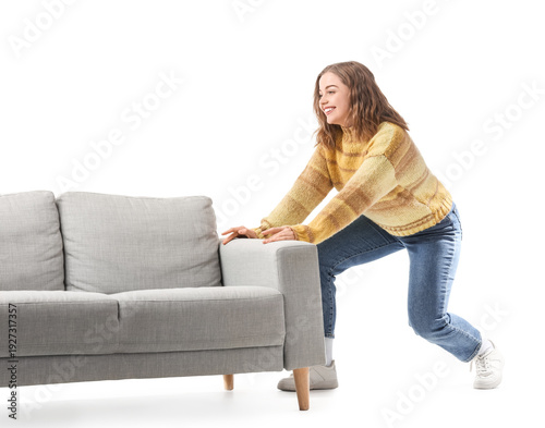 Young woman moving grey cou...