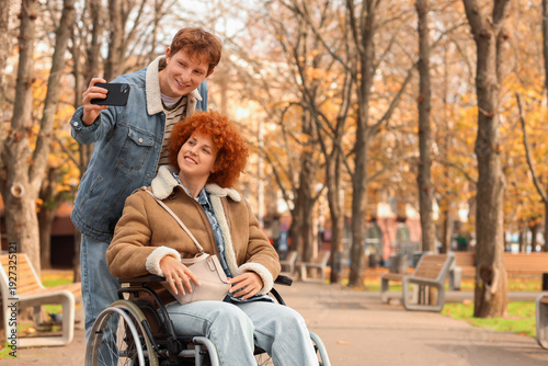 Young woman in wheelchair w...