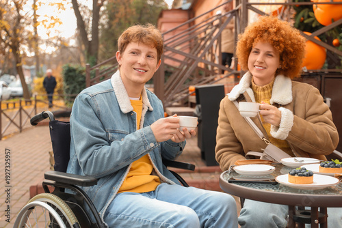 Young man in wheelchair wit...