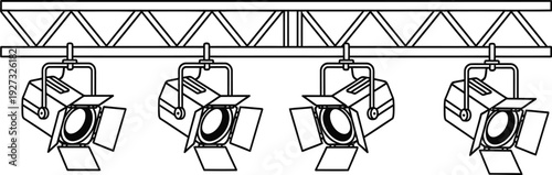 Four stage lights mounted on a metal truss