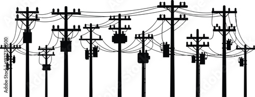 Black silhouette of multiple power lines and utility poles with transformers in a landscape view