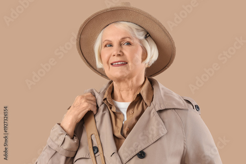 Senior woman in stylish tre...