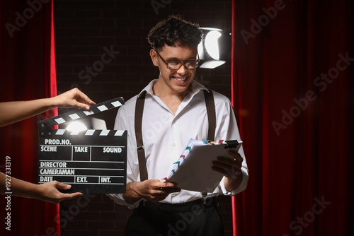 Male screenwriter reading s...