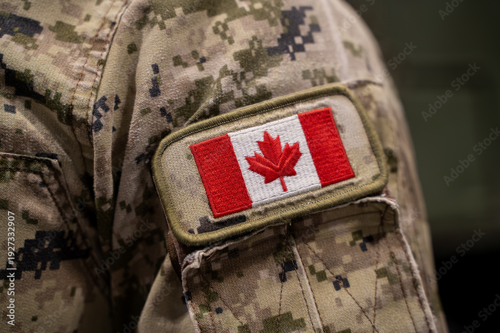 Obraz premium Close up of Canadian flag patch on military uniform