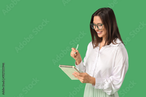 Young woman with notebook o...