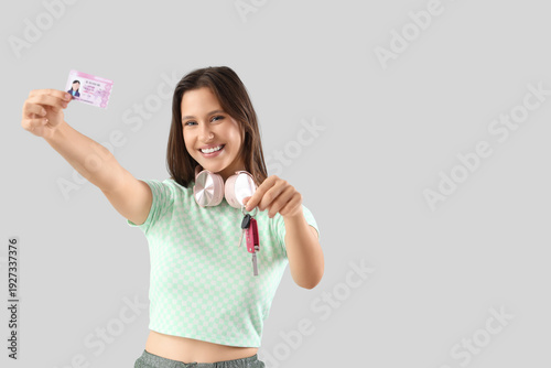 Happy young woman with driv...