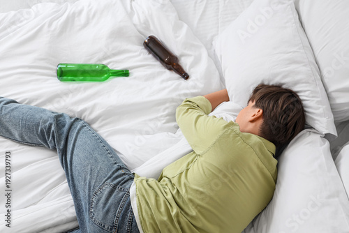 Drunk young man sleeping in...
