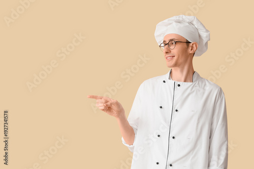 Male chef pointing at somet...