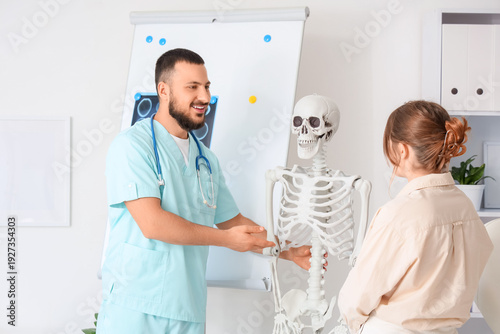 Male doctor showing human s...