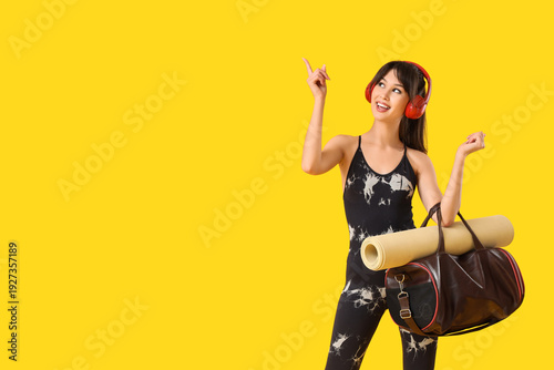 Young woman in headphones w...