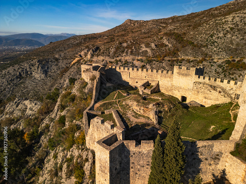 Konstfotografi Blagaj Teke dervish monastery and medieval stone fortress castle aerial drone panorama view in Bosnia