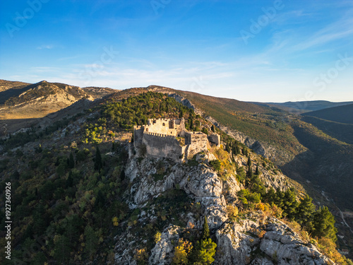 Fotografie Blagaj Teke dervish monastery and medieval stone fortress castle aerial drone panorama view in Bosnia