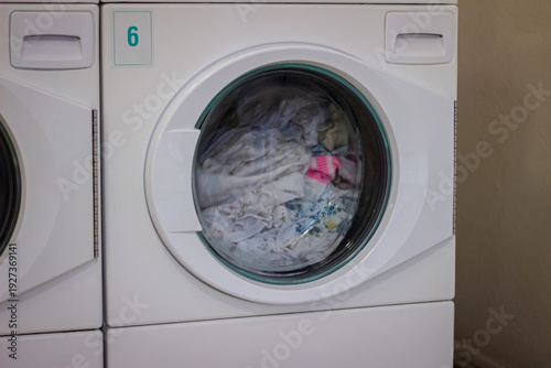 Wallpaper Mural Laundry washing inside washing machine in self service laundromat Torontodigital.ca