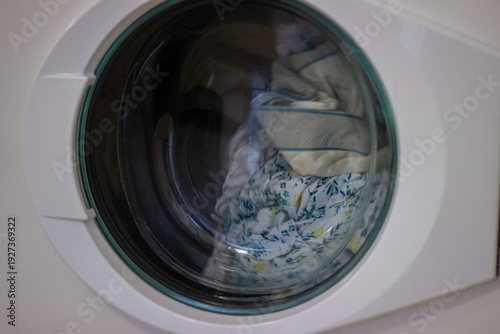 Wallpaper Mural Clothes rotating inside washing machine drum during wash Torontodigital.ca