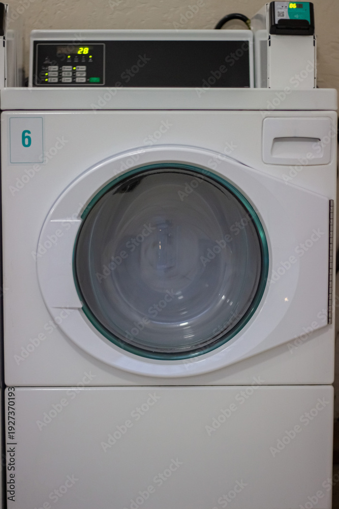custom made wallpaper toronto digitalTumble dryer running with laundry spinning in self service laundromat