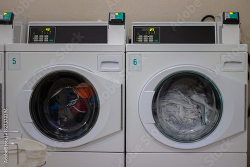 Wallpaper Mural Two front load washers washing laundry in self service laundromat Torontodigital.ca