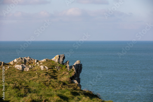 Bilde på lerret Rugged coastal cliffs and rock formations overlooking the calm Atlantic Ocean at