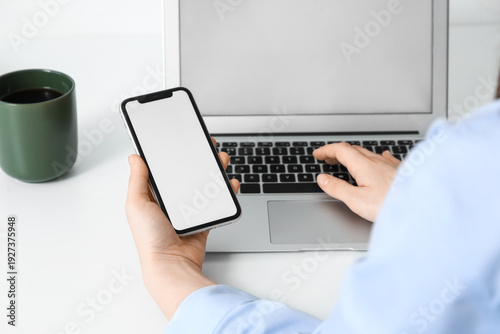 Young woman using blank mob...