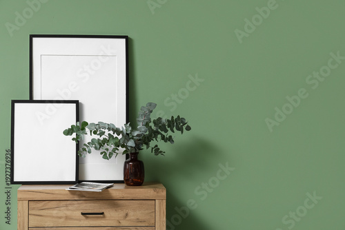 Blank photo frames and vase...