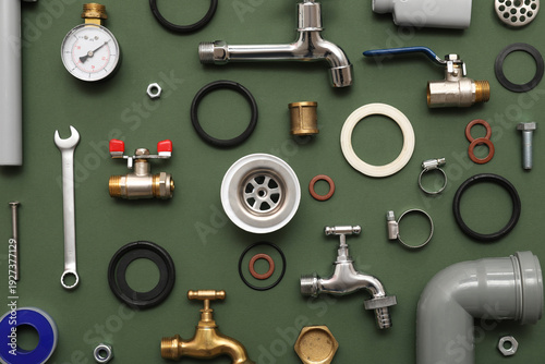 Set of plumber's items on g...