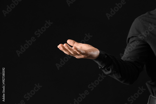 Businessman holding somethi...