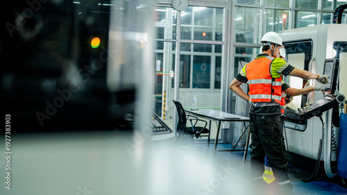Tableau sur toile Three engineers program an industrial robot or 5-axis CNC machine using an AI interface