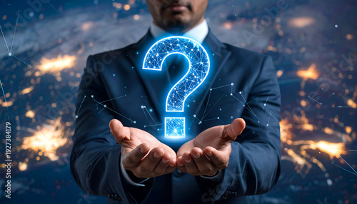 Businessman holding a glowing question mark surrounded by digital network connections. Concept of problem solving, innovation, and technology-driven solutions.