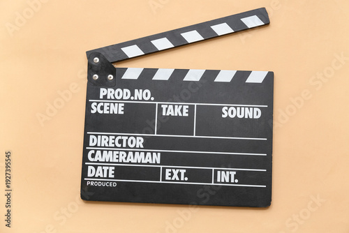 Movie clapper on beige back...