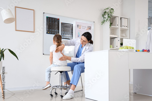 Female osteopath working wi...